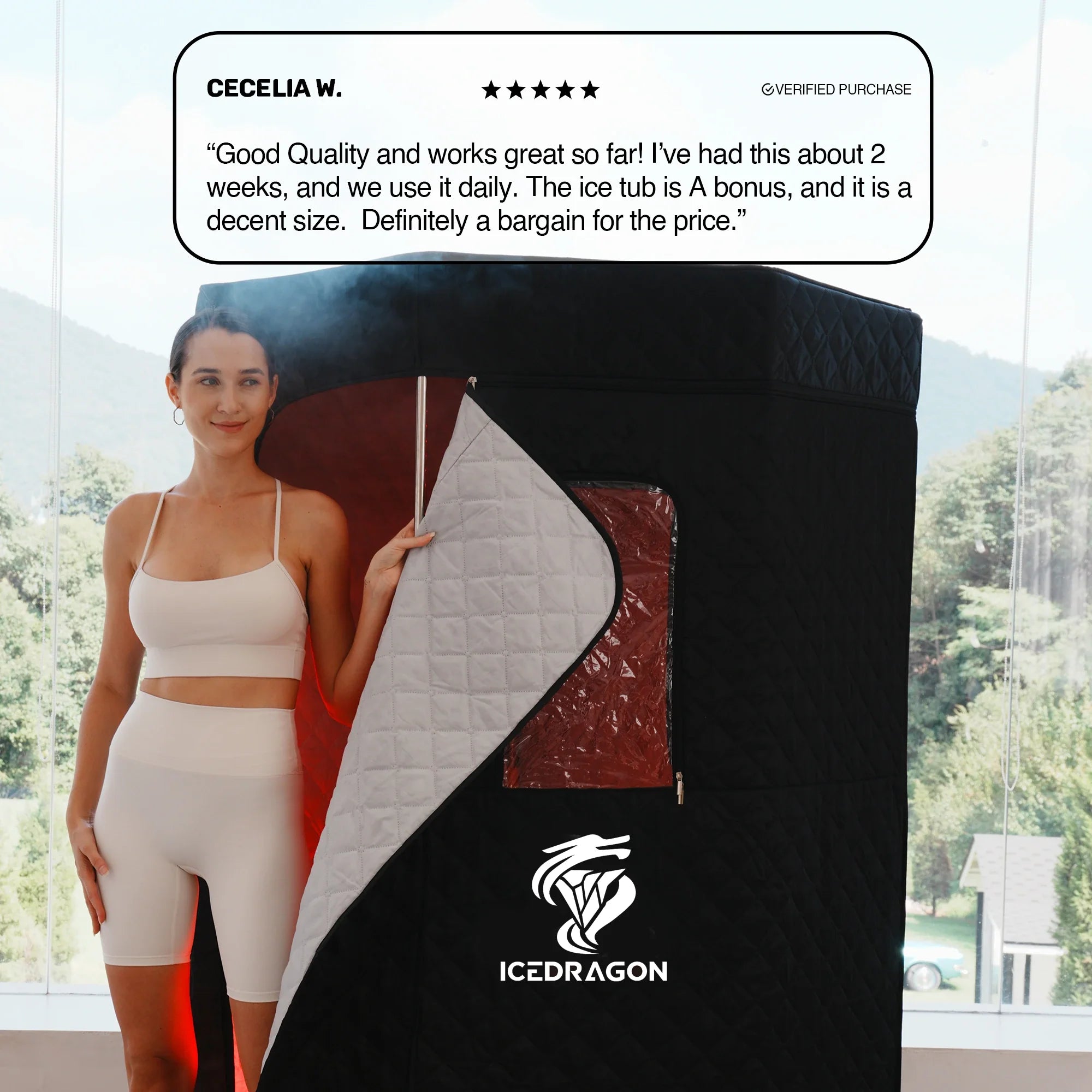 Person holding a black and white sauna door with a review above it, set against a blurred outdoor background.