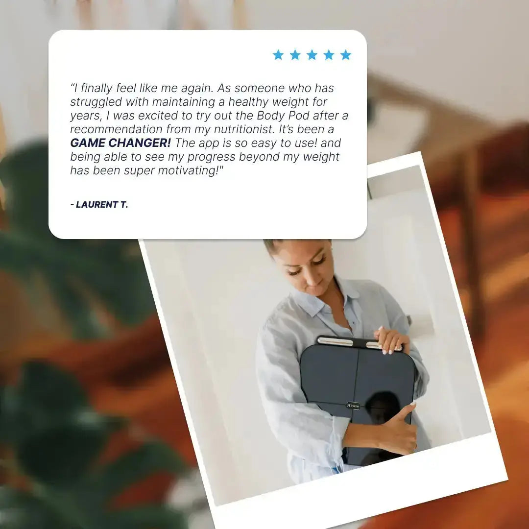 Person holding a Hume Body Pod with a five-star review above it, set against a blurred indoor background.